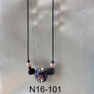 Black cord necklace with large Purple jewel bead